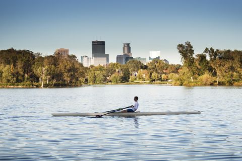 sculling boat, lake of the isles, downtown minneapolis, minnesota cityscape