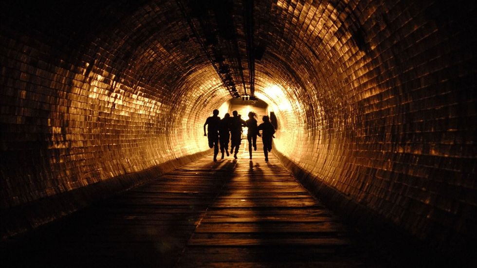 tunnel escapethe group runs through a tunnel as london is being firebombed