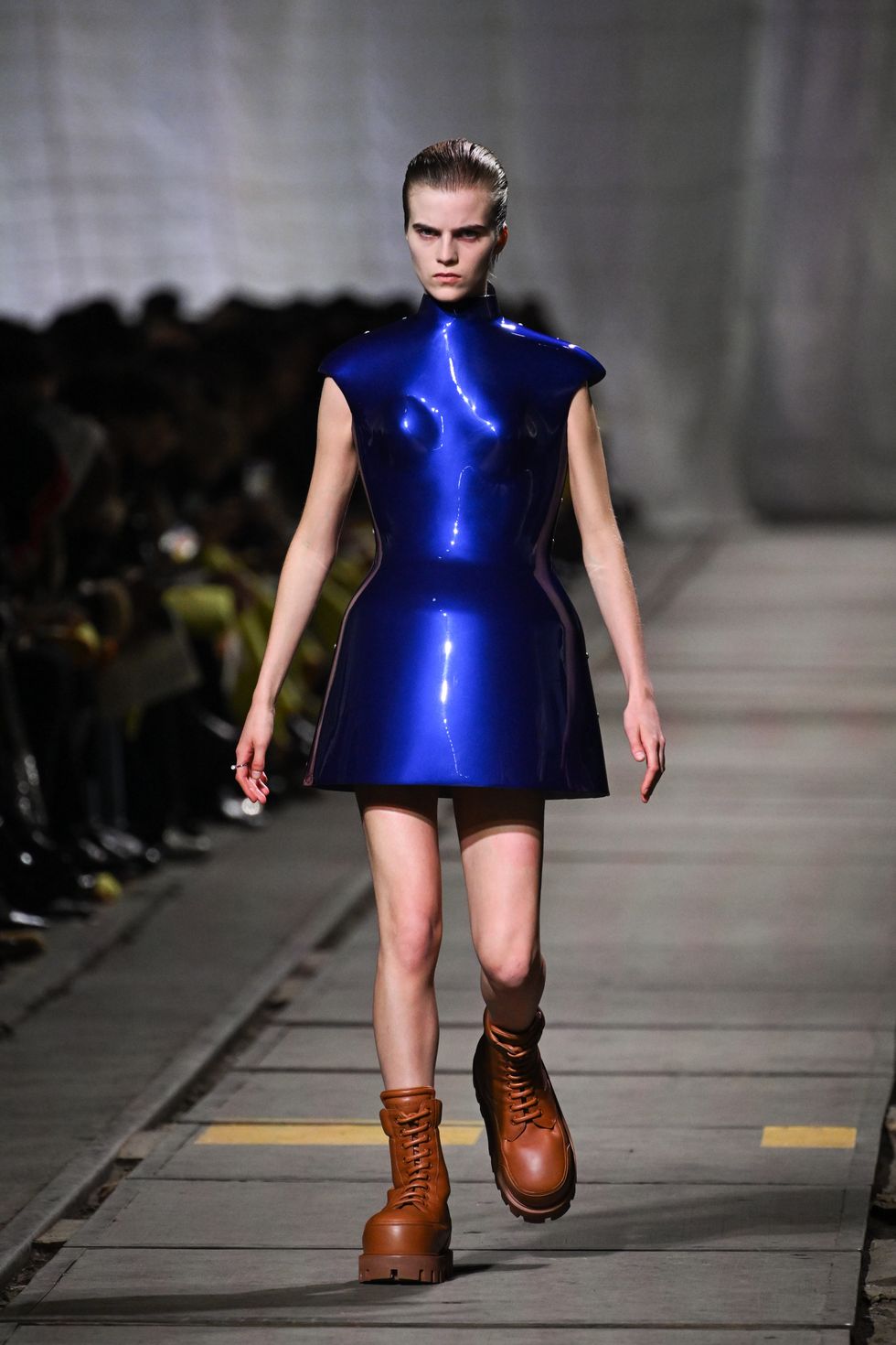 a model walks the runway during the alexander mcqueen womenswear aw 2024 show in blue dress