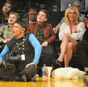 britney spears, her sons, and boyfriend sam asgharit at the los angeles lakers game