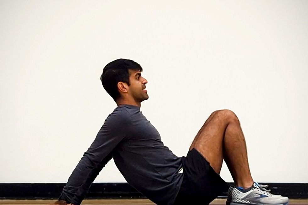 hathiramani practices the seated bicep stretch exercise