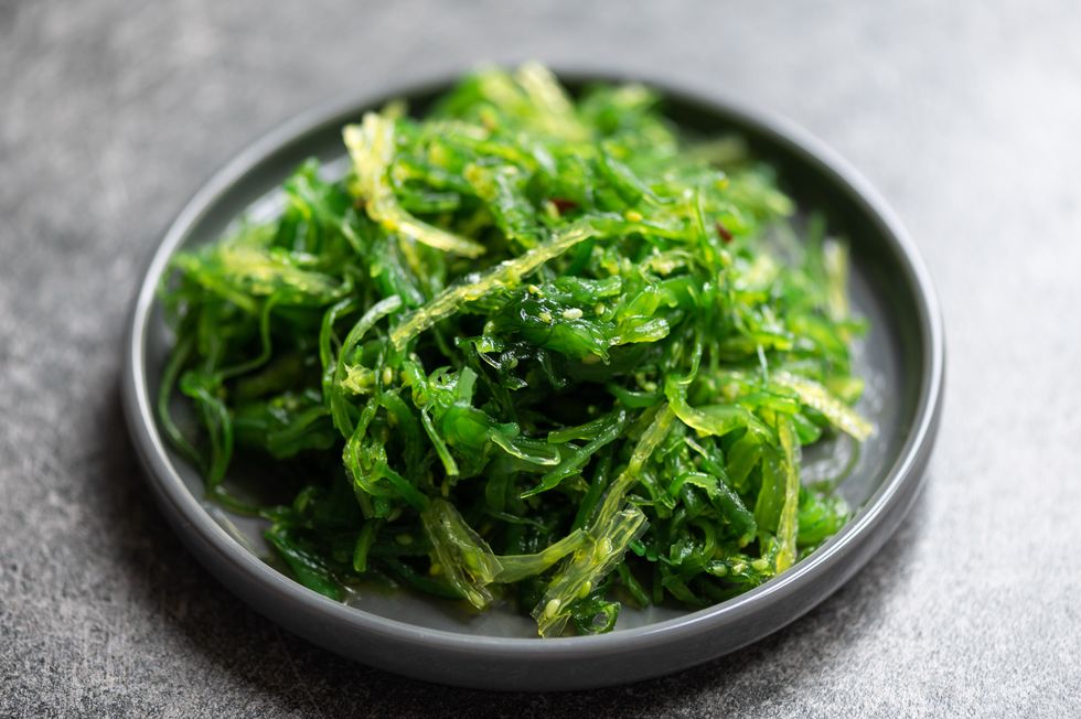 seaweed salad is super healthy and nutritious snack with sesame seeds, dietary supplement, superfood of the sea, green chuka or algae