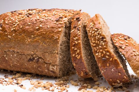 seed bread, a slice cut on white background