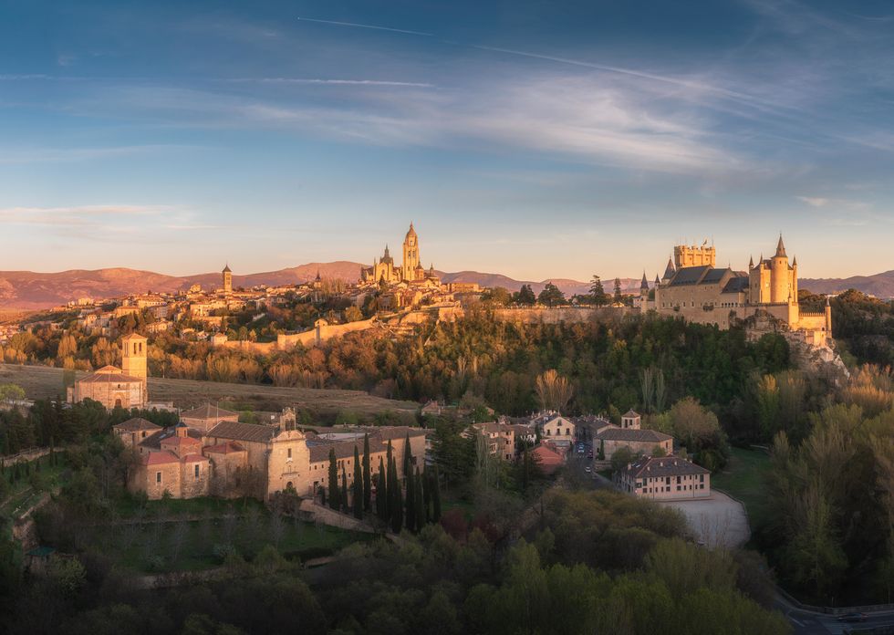 segovia city skyline at dusk, with the cathedral and castle