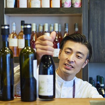 selecting wine, wine store owner