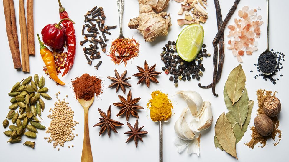 a selection of spices on a white background
