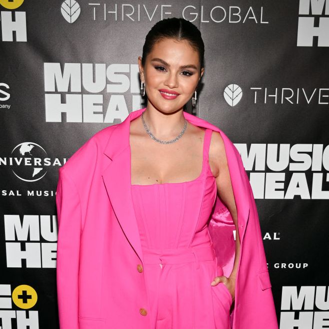 Selena Gomez Goes Pantsless With Thigh-High Black Boots and Men's Button-Down