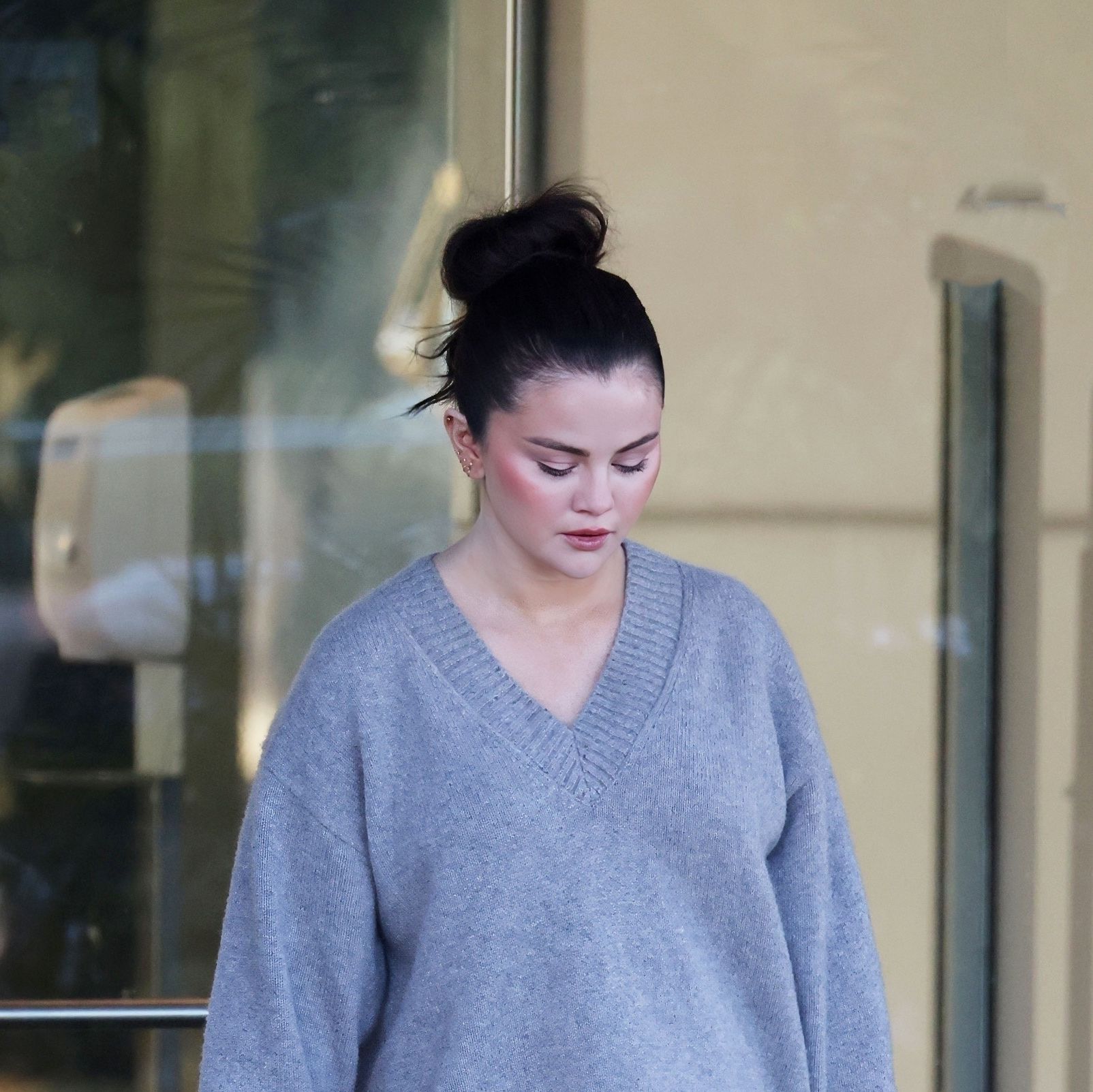 Selena Gomez Shows Off Her Cozy Work Attire in a Reformation Sweater