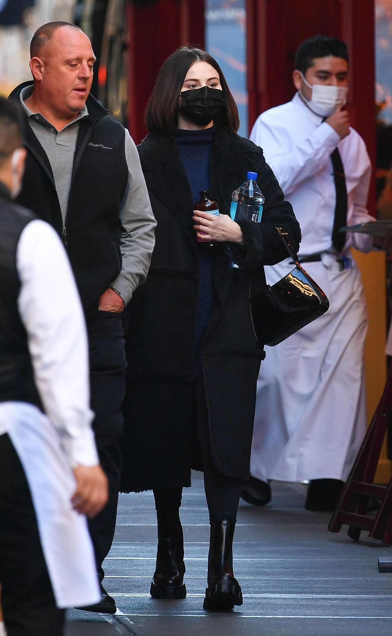 Selena Gomez wearing Black Pea Coat, Black Cropped Sweater, Light