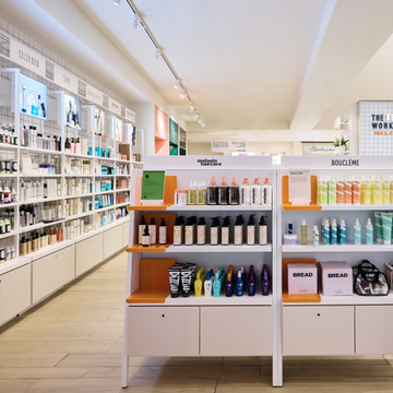 selfridge's new hair hall is stocked with haircare products on light pink shelves