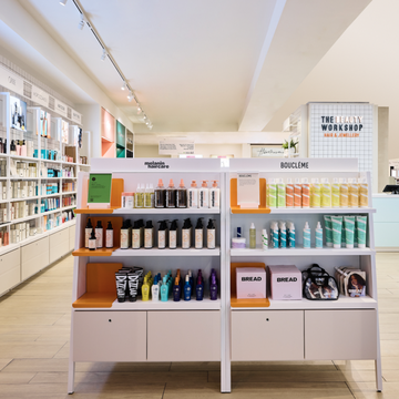 selfridge's new hair hall is stocked with haircare products on light pink shelves