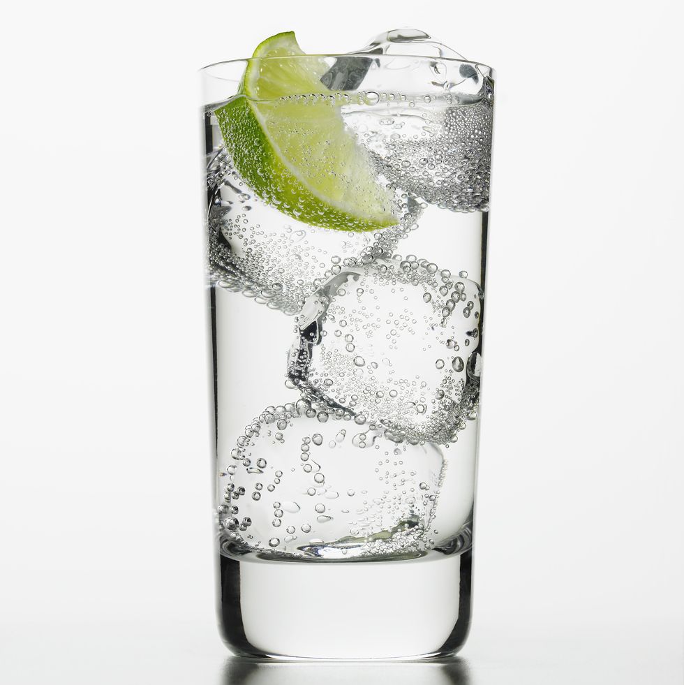 ranch water seltzer water with lime wedge and tequila low calorie drink
