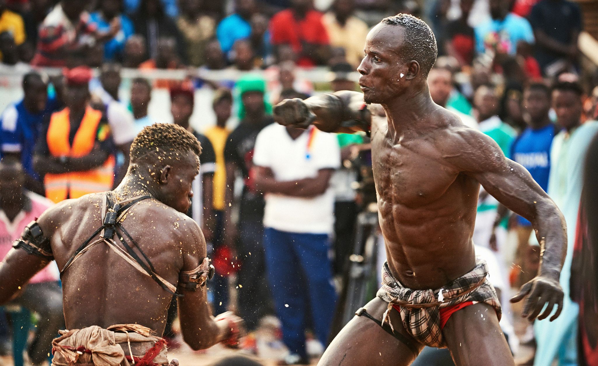 People, Barechested, Human, Crowd, Muscle, Competition event, Contact sport, Event, Tribe, Temple, 