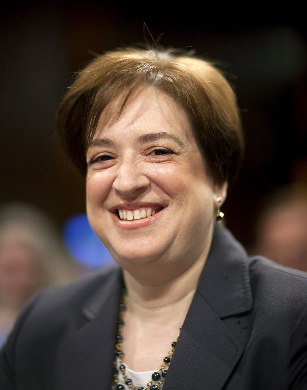 Gap-Toothed Grinners: Elena Kagan, nominee for the U.S. Supreme Court, arrives for the second day of her confirmation hearing by the Senate Judiciary Committee in Washington, D.C., U.S., on Tuesday, June 29, 2010. Kagan told senators that the framers of the U.S. Constitution anticipated it would be interpreted in light of changes in society, technology and the country at large. Photographer: Joshua Roberts/Bloomberg via Getty Images *** Local Caption *** Elena Kagan