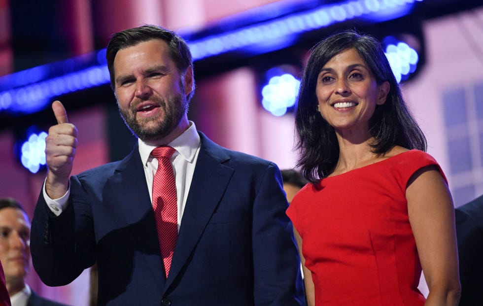 jd vance giving a thumbs up gesture with wife usha standing next to him