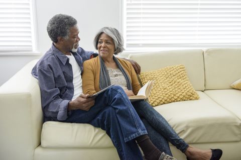 senior african american couple on sofa at home