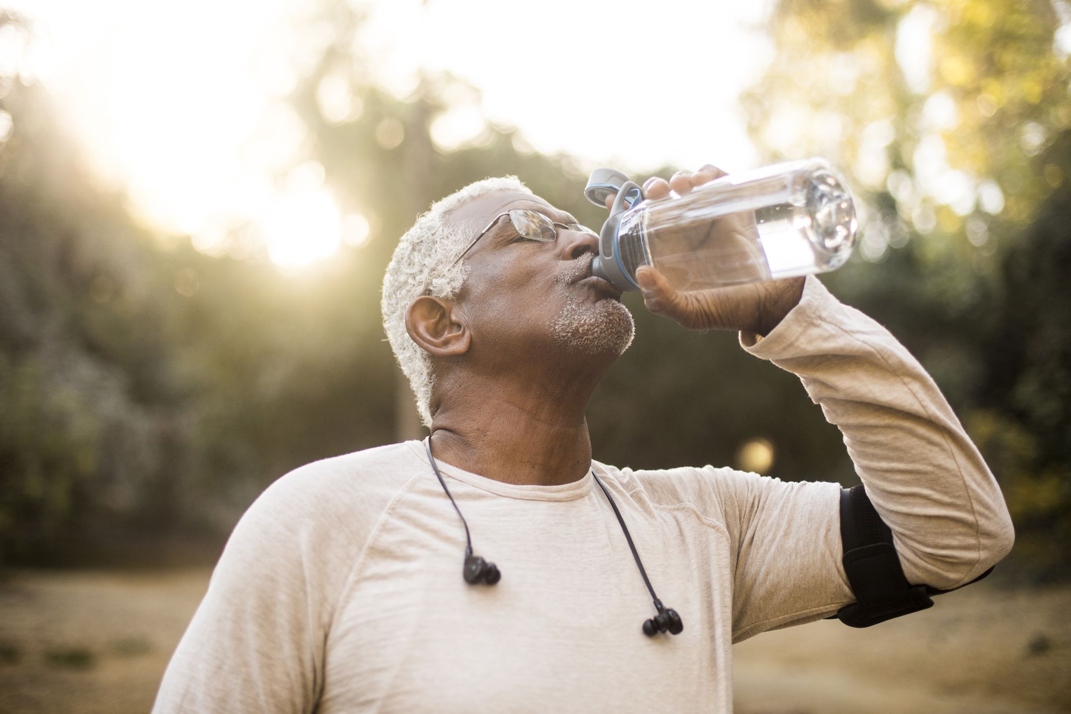 https://hips.hearstapps.com/hmg-prod/images/senior-african-american-man-drinking-water-royalty-free-image-1666011539.jpg