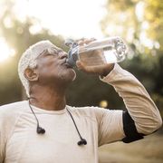senior african american man drinking water