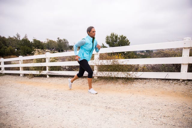 senior african american woman running