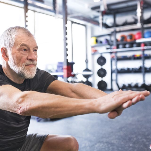 Senior man exercising in gym