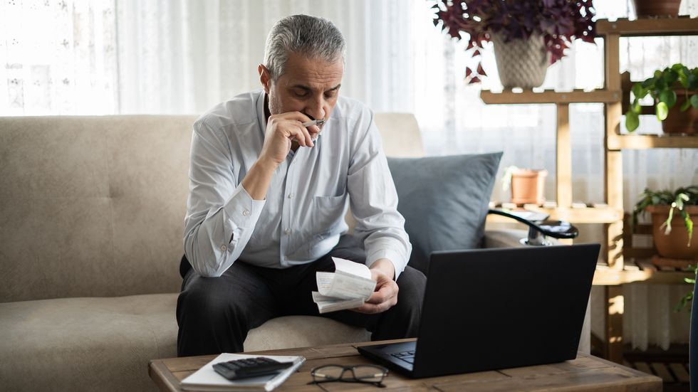 senior man feels stressed about financial problems