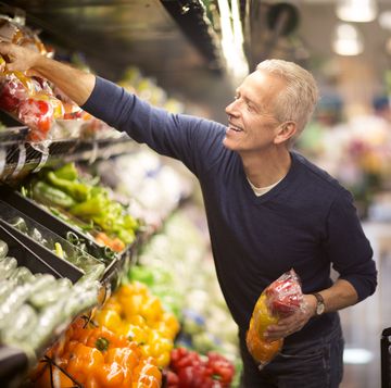senior man goes grocery shopping