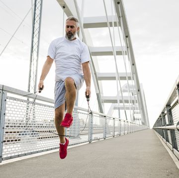 senior man jumping rope during workout