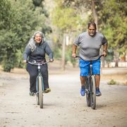 senior mexican couple riding bikes
