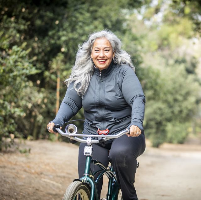 senior mexican woman riding bicycle
