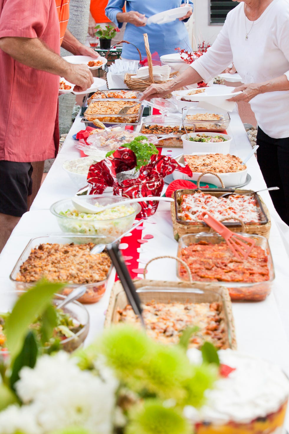 Older people at potluck lunch