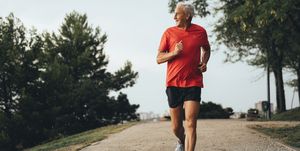 senior retired man runs and performs exercise