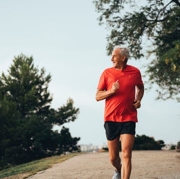 senior retired man runs and performs exercise