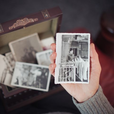 senior woman discovering old photographs