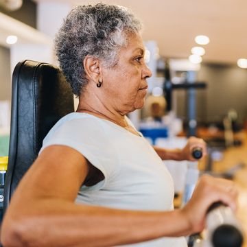 senior woman exercising at the gym