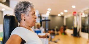 senior woman exercising at the gym