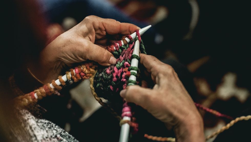 senior woman hands knitting