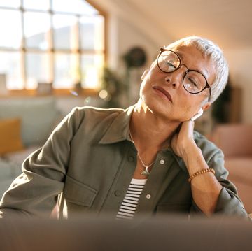 senior woman having neck pain