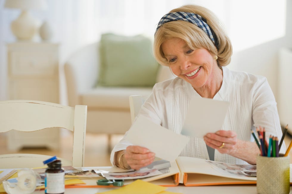 long distance valentines day - Senior woman looking at photographs