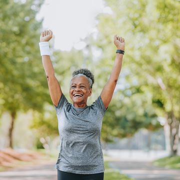 senior woman running happy and celebrating