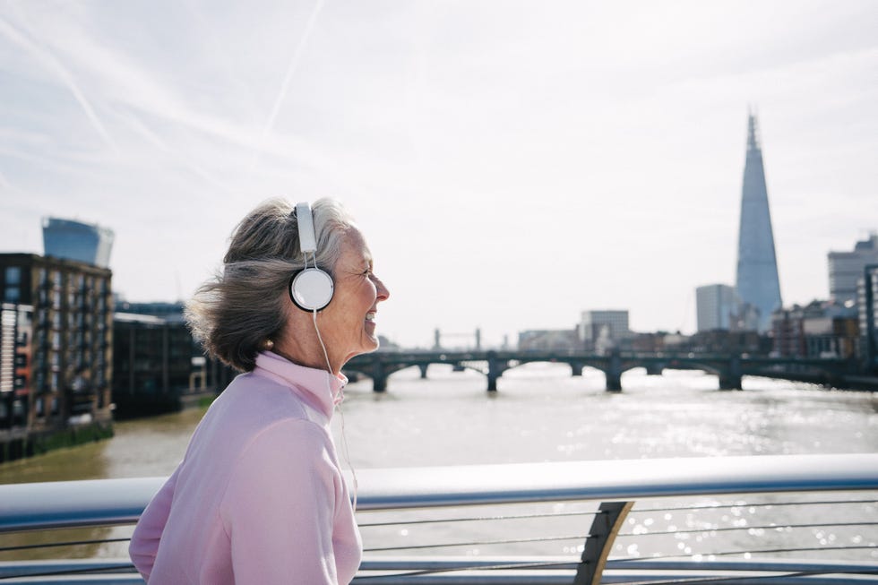 senior woman running in london downtown