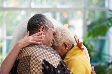 senior women hugging grief emotional