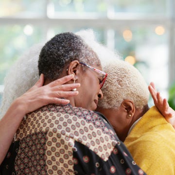 Women hugging senior women hugging grief emotional