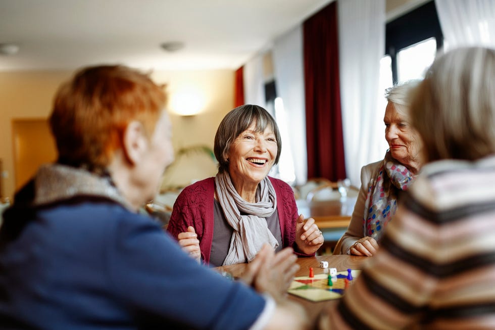 senior women playing board game