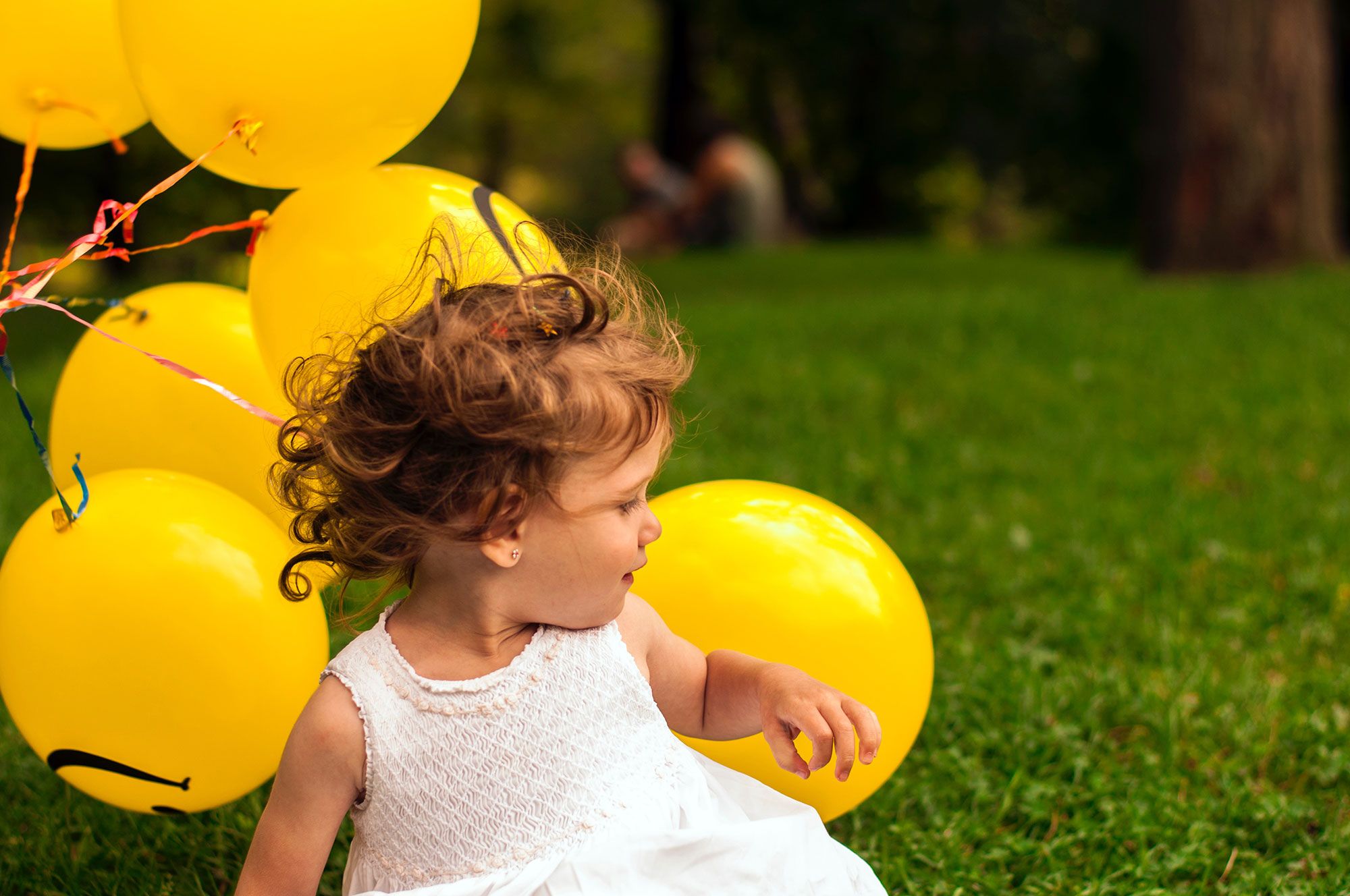 People in nature, Child, Yellow, Balloon, Party supply, Toddler, Grass, Fun, Smile, Happy, 