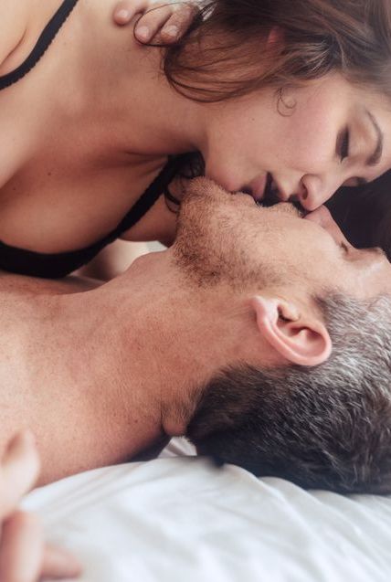 Sensual lovers in bed making love
