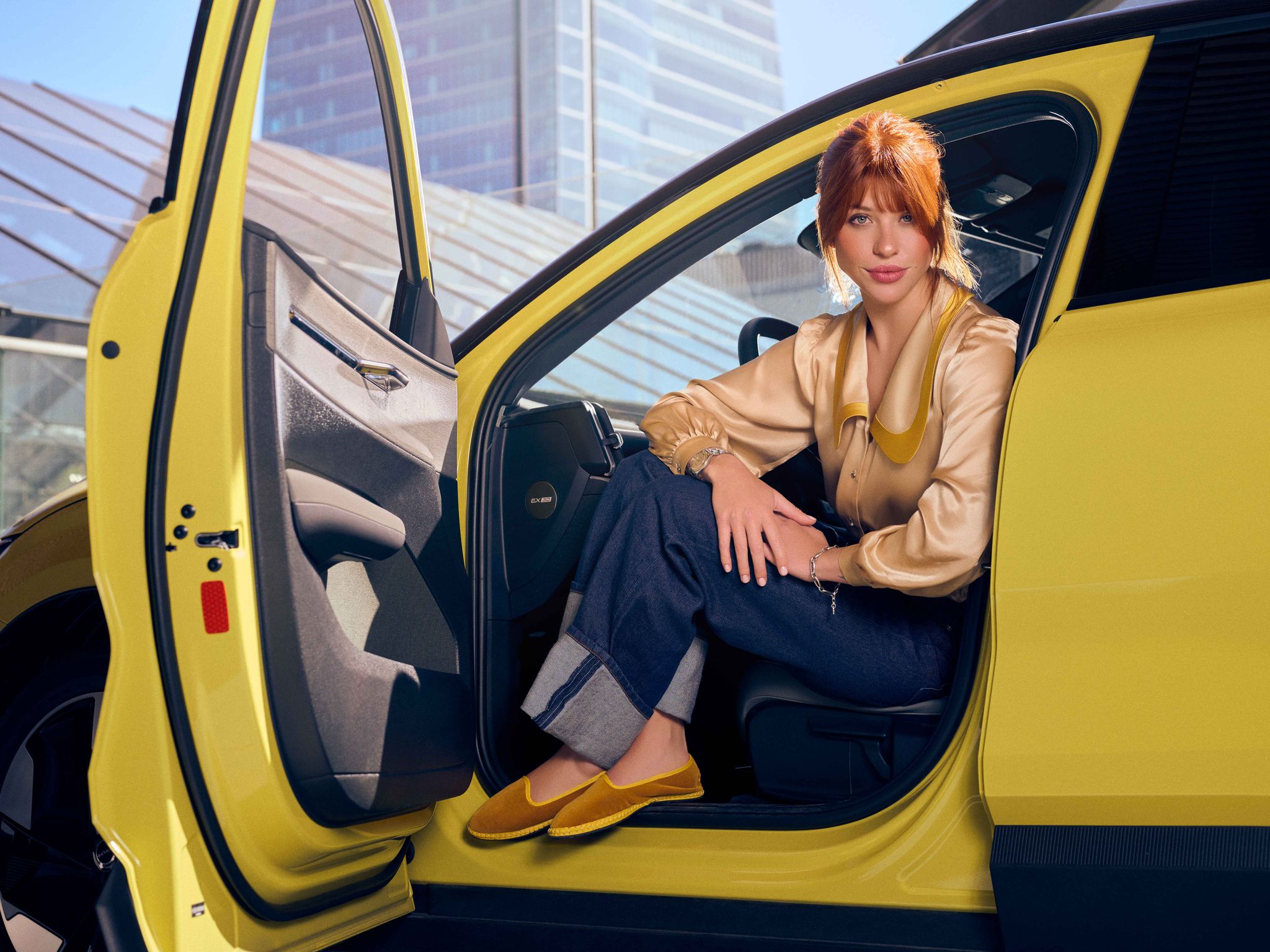a woman sitting in a yellow airplane