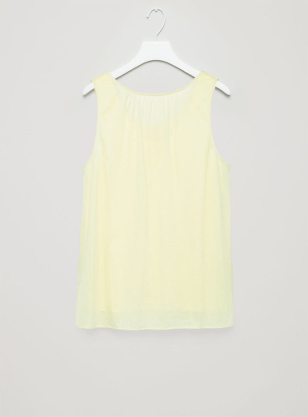Clothing, White, Yellow, Dress, Sleeveless shirt, camisoles, Outerwear, Sleeve, Blouse, Clothes hanger, 