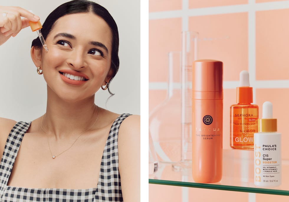 person applying serum with bottles of skincare products displayed