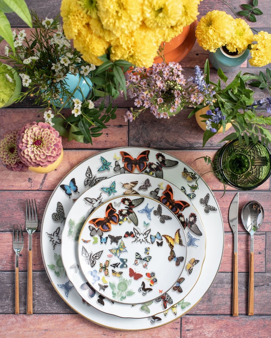 Dishware, Plate, Table, Yellow, Cut flowers, Flower, Tablecloth, Textile, Tableware, Plant, 