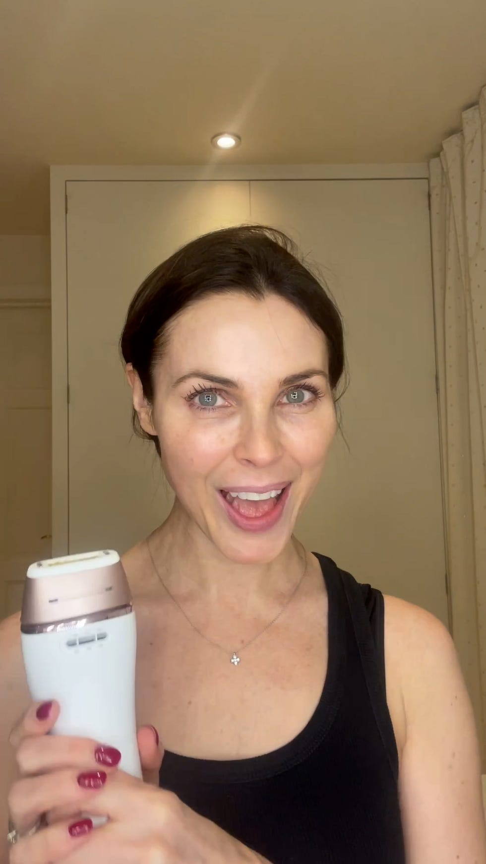 person holding a skincare device